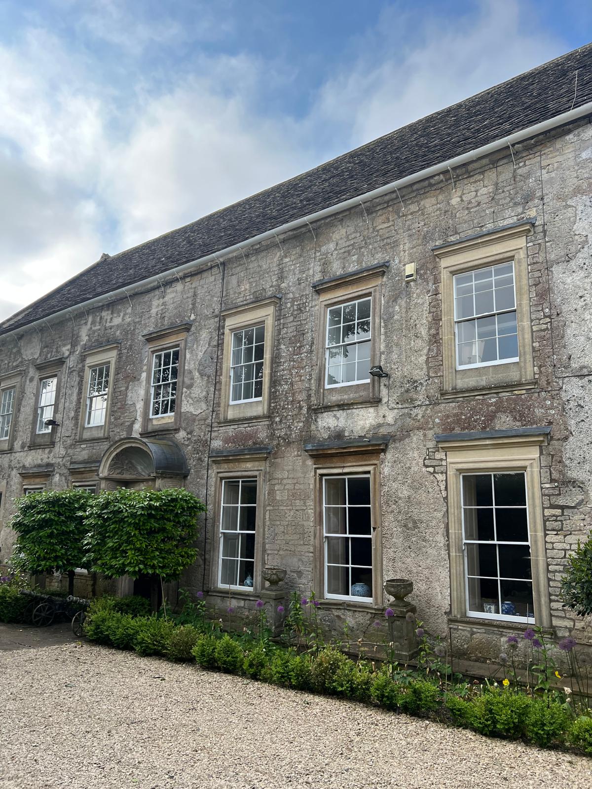 Historic stone property with sash windows and landscaped frontage