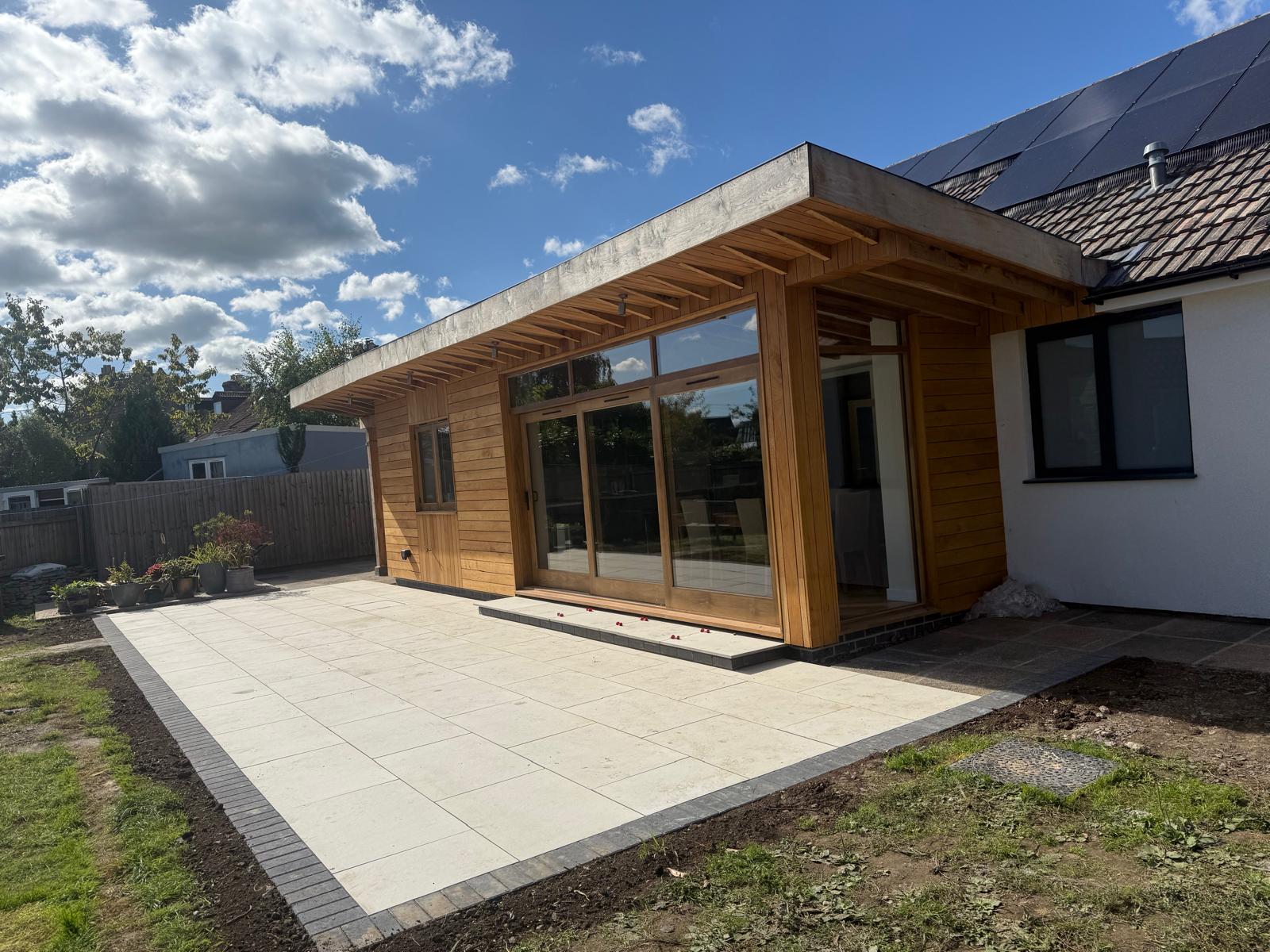 Completed timber-clad extension and patio