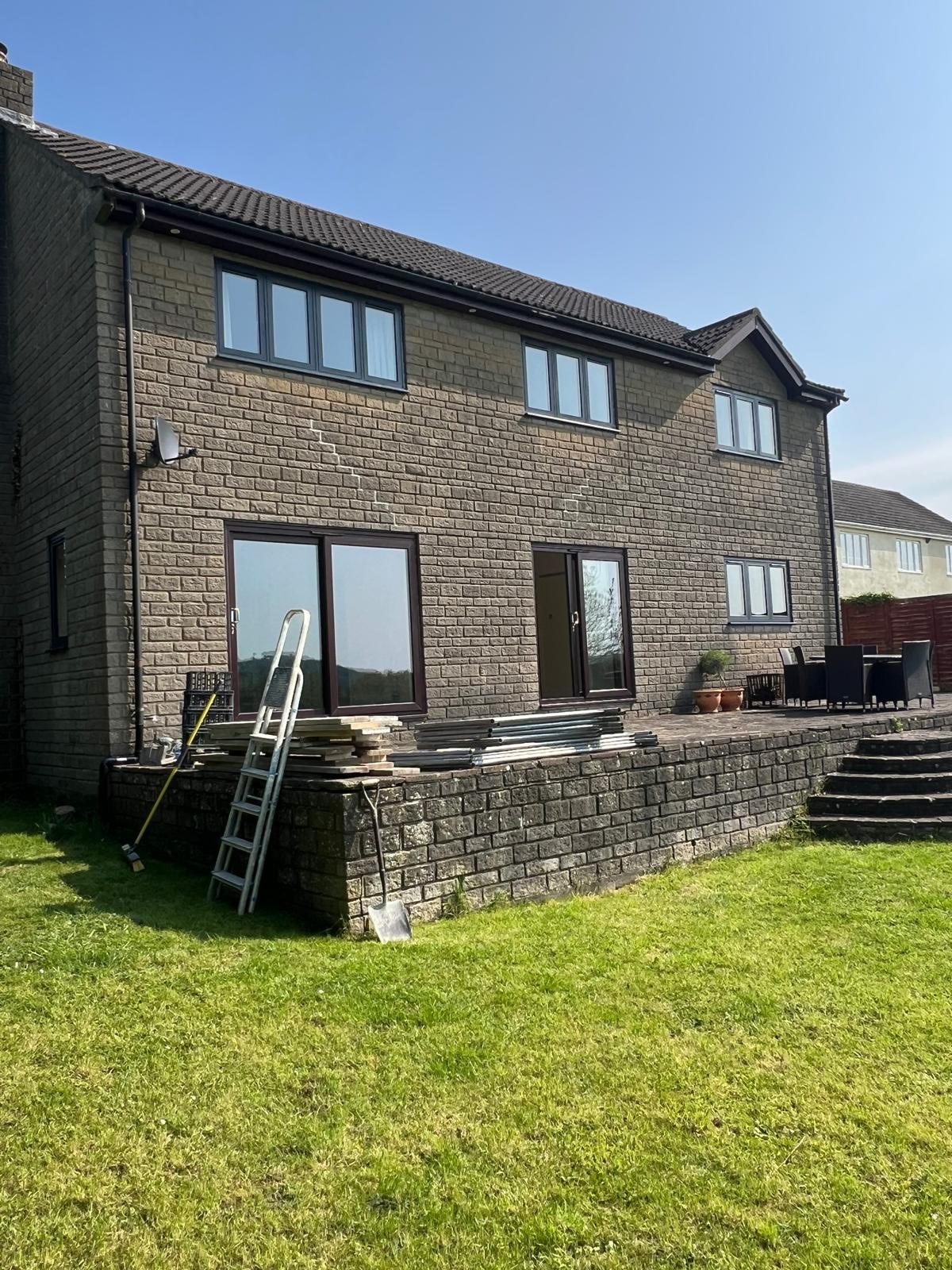 Rear of the house and work area before the patio was completed