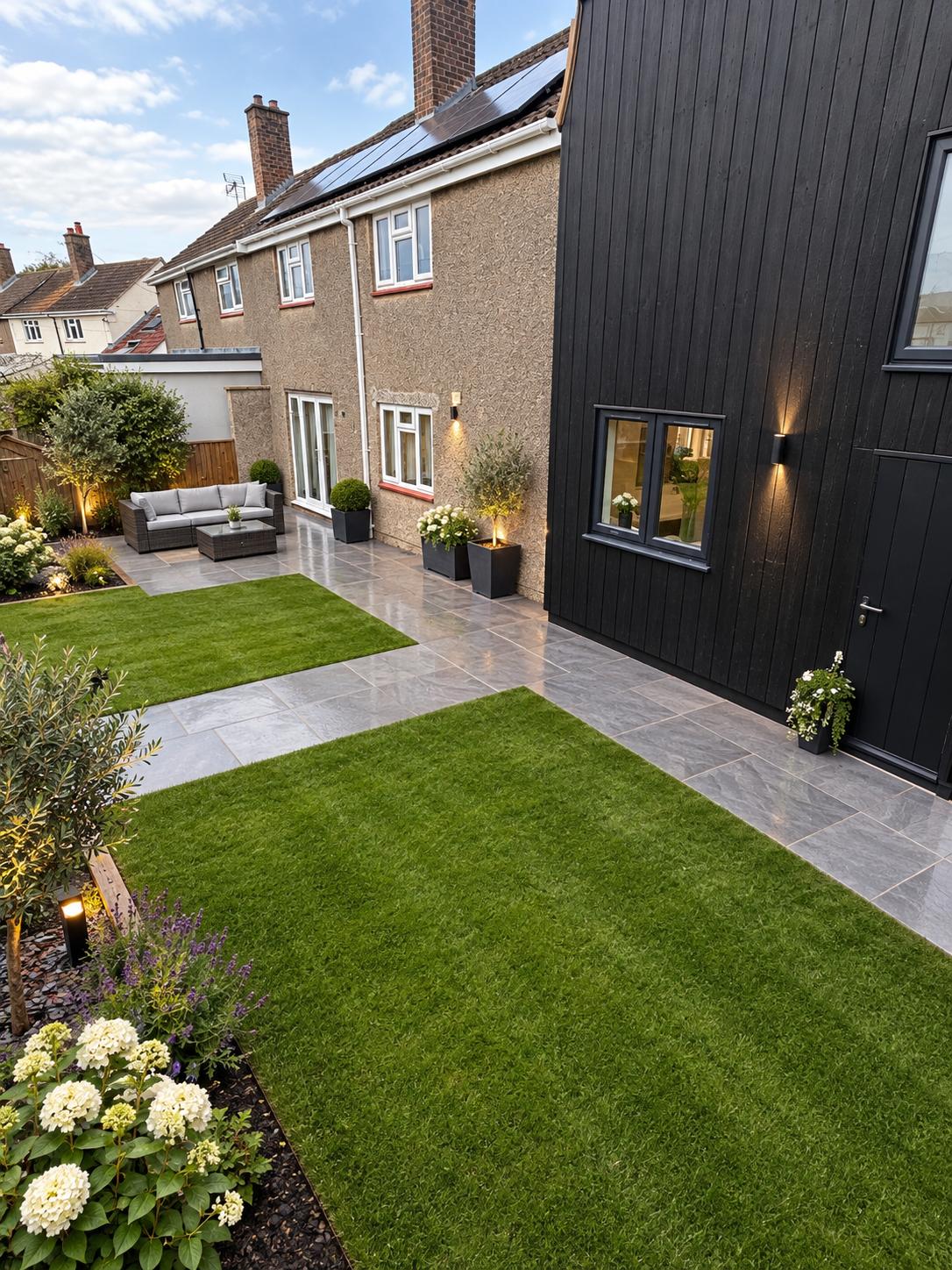 Dark-clad modern extension viewed from the garden
