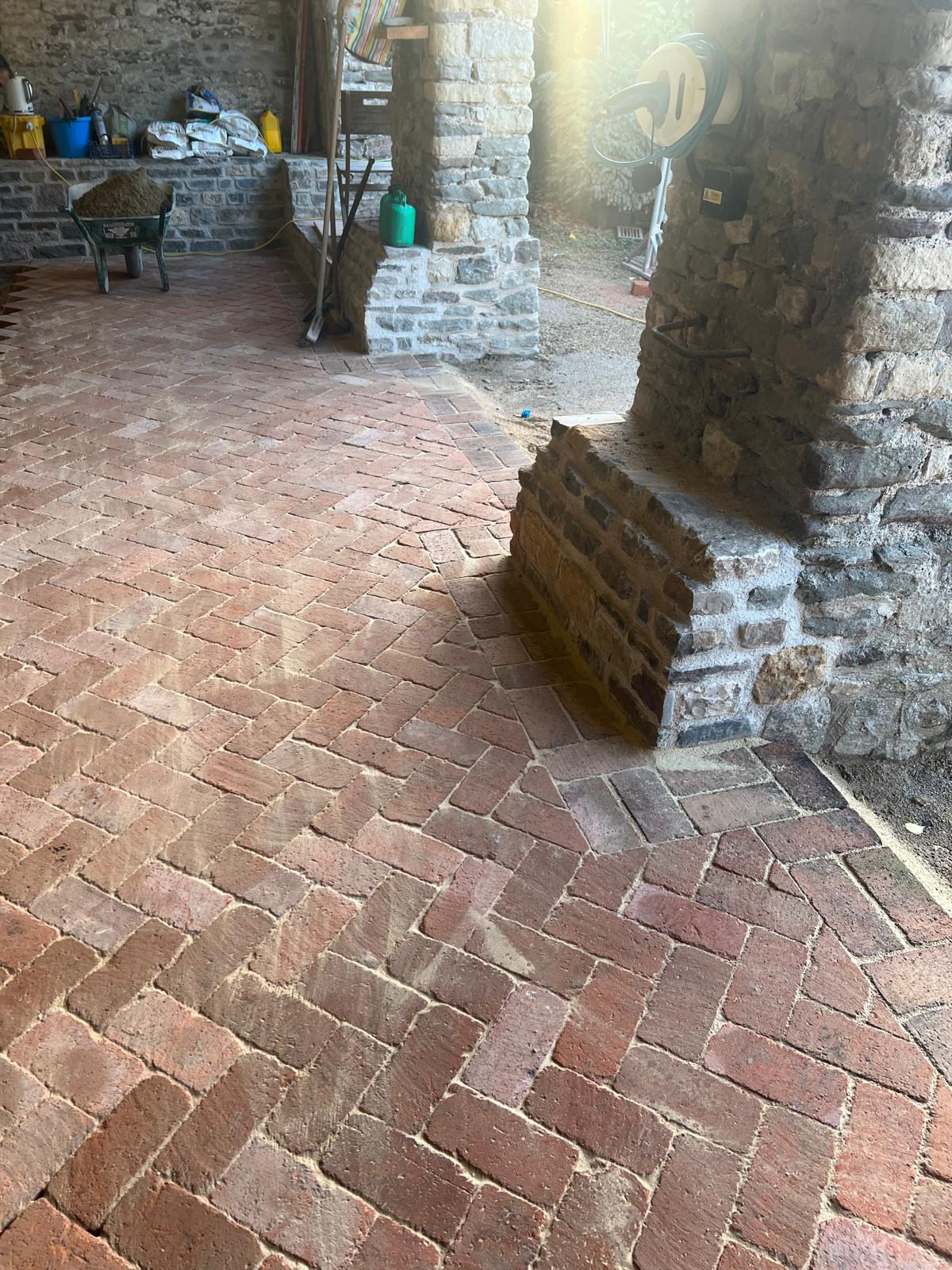 Detailed view of reclaimed brick flooring